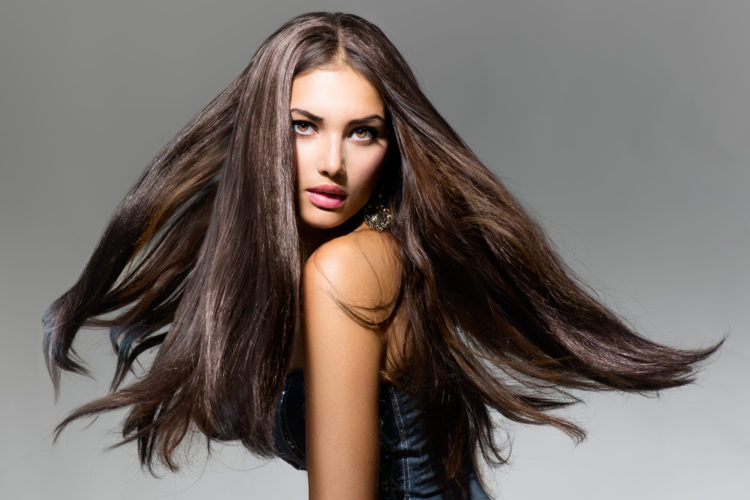 Fashion Model Girl Portrait with Long Blowing Hair